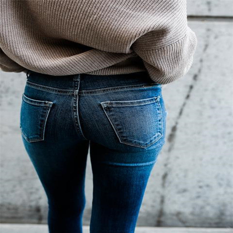 Frayed white ripped slim fit jeans