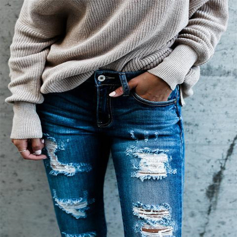 Frayed white ripped slim fit jeans