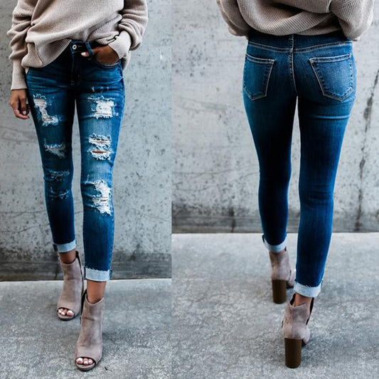 Frayed white ripped slim fit jeans