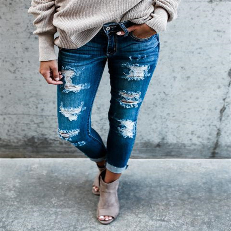 Frayed white ripped slim fit jeans